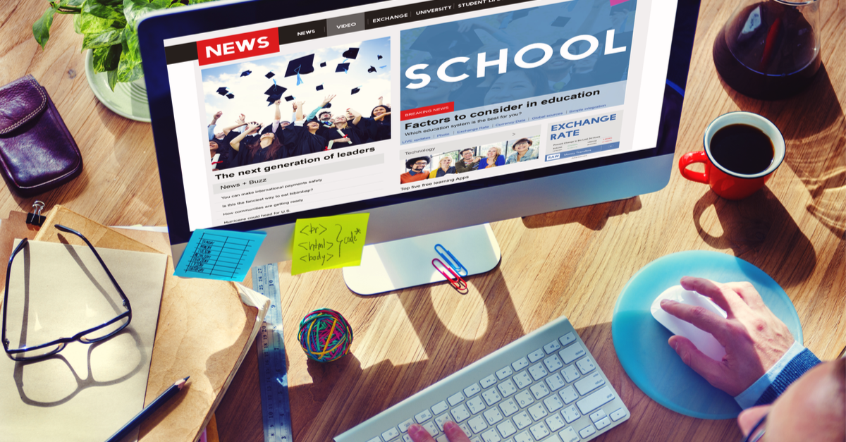 Computer with education news website open in browser