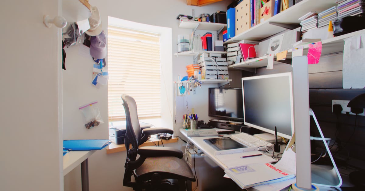 Messy and cluttered home office space